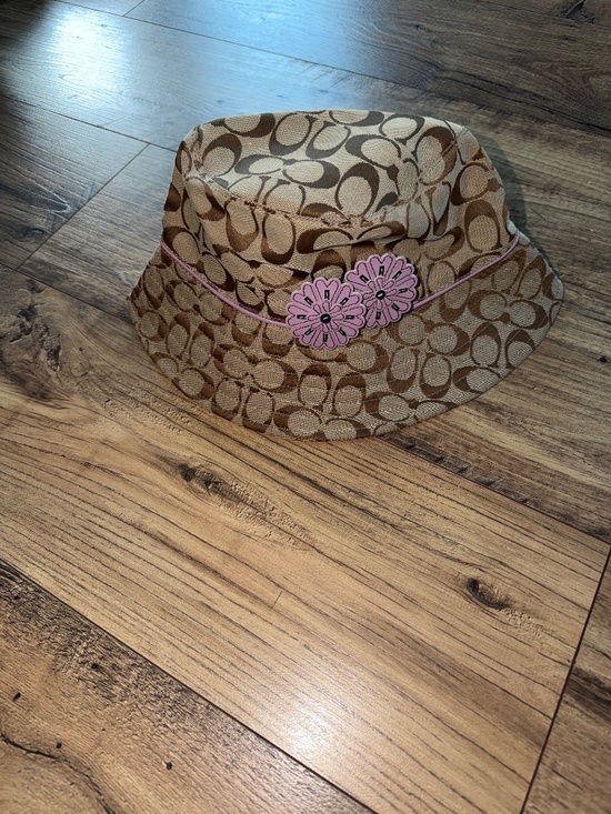 Coach signature brown hat with purple flowers/trim M/L.